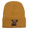 Close-up of mustard yellow knit beanie featuring a highland cow embroidery detail - Stretchy / Khaki
