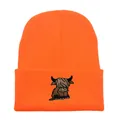 Knitted bright orange winter beanie featuring detailed Highland cattle animal embroidery - Stretchy / Orange