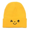 Bright yellow knit beanie with a cute winking smiley face embroidery for winter warmth - 54-60cm / Yellow