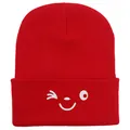 Winter red ribbed beanie hat featuring a white wink face embroidery for women - 54-60cm / Red