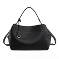Minimalist black leather tote bag with top handle and silver buckle for daily commute - Black