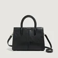 Classic black leather tote bag with gold hardware and dual handles for daily use - Black