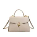 Elegante ivoren crossbodytas met kiezeltextuur en een verfijnde gouden sluiting - Olifantsgrijs
