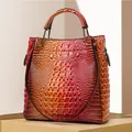 Red and orange gradient tote bag with embossed crocodile texture and dual handles - Iridescent Orange