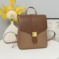 Chic two-tone brown backpack featuring a V-stitch flap and golden metallic square lock - Khaki