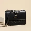 Classic black leather chain crossbody bag featuring a silver deer head and V-quilt pattern - Black