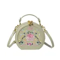 Light green semi-circle handbag with ethnic floral embroidery and golden dual zipper - Green