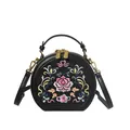 Black cross-body bag with ethnic floral embroidery and gold dual zipper closures - Black