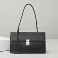 Minimalist black leather shoulder bag with silver square buckle and sleek modern flap - Black