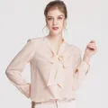 Elegant peach silk shirt with pussy-bow tie neck and front buttons for women - Light Beige