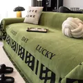 Dark green chenille sofa cover with Lucky Day text pattern and tassel edges - 180x130 / Green