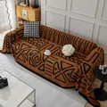 Brown and black geometric plush sofa cover with soft shorn velvet texture and boho patterns - Chocolate