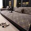 Funda de sofá de chenilla gris con diamantes dorados sobre sofá de cuero negro - Gris