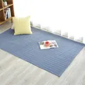 Pastoral blue quilted cotton rug with diamond stitching on light wood floor in a cozy room - 110x210cm / Blue