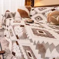 Winter plush sofa blanket with bohemian geometric diamond patterns in creamy white - Brown