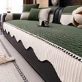 Thick corduroy sofa cover in dark green with white pleated edges and bead tassels - Green