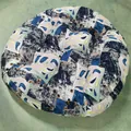 Macro detail of round patchwork seat cushion with blue floral and geometric patterns - New Pattern-14