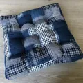 Close-up of quilted cotton linen floor cushion with dark blue patchwork checkered patterns - New Pattern-10