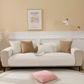 Detailed view of quilted off-white sofa cover with leaf patterns and scalloped edges - 70x70 / Off White