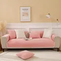 Close-up of quilted plush sofa cover with white pom-pom trim and leaf pattern embroidery - 70x70 / Pink