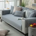 Close-up of gray-blue cooling ice silk sofa cover with decorative CHANGE lettering tape - Chair Pad (45x45) / Blue