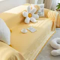 Detail of yellow cotton sofa cover featuring cartoon bear patterns and decorative tassels - 180*130 / Cotton Bear-Yellow