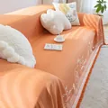 Detail of orange cotton linen sofa throw with knit texture, bear pattern, and fringes - 180*130 / Cotton Bear-Orange
