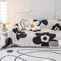 Modern black and white floral sofa cover with tassels and matching jacquard cushions - 180*130 / White With Black Flowers