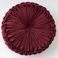 Burgundy round velvet pumpkin cushion with pleated design and center button - Burgundy