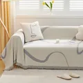 Minimalist beige chenille sofa cover with grey abstract lines and tassel fringe detail - Light Gray