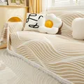 Beige and white wave pattern knit sofa cover blanket with decorative tassel edges - Liquid Gold (Beige Wave)