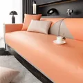 Waterproof faux leather sofa cover in coral pink with textured non-slip finish - Grace Orange