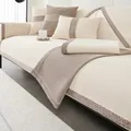 Detail of chenille sofa cushion showing woven texture and tweed border trim in beige - 70x70 / Off White