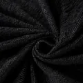 Black chenille sofa cover with herringbone weave texture and soft fringed edges - Black