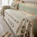 Detail of bohemian jacquard chenille sofa cover with geometric patterns and fringe - Bohemian Geometric Pattern