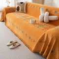 Copridivano boho in ciniglia arancione con motivi geometrici e bordi con frange - 180x380cm / Arancione