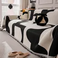 Jeté de canapé en tricot aux motifs géométriques noir et blanc avec franges - Série Mika / 180x90cm / Noir