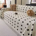 Modern chenille sofa cover with black grid pattern and decorative fringe in cream white - 180*130 / White