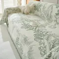 Off-white chenille sofa cover with green floral lily of the valley print and fringe - Green