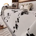 Copridivano retrò in ciniglia con jacquard floreale nero e nappe grigie ai bordi - 180*130 / Calicanto Bianco