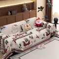 Copridivano natalizio in ciniglia con motivi di Babbo Natale e nappe bianco crema - 180*130 / Coperta Buon Natale