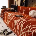 Copridivano in ciniglia arancione con jacquard floreale bianco e frange - Arancione