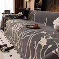 Copridivano in ciniglia grigia con motivi floreali e bordi con frange eleganti - Grigio
