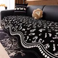 Modern black and white leopard print chenille sofa cover with scalloped pearl edge detail - Black