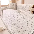 Detail view of floral chenille sofa cover with decorative tassels and soft texture - Gray / 180*130