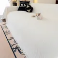White chenille sofa cover with vertical stripes and tassel edges in a cozy living room - 180*130 / Off White