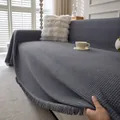 Dark grey waffle weave chenille sofa cover with decorative tassels in a cozy setting - 180*90 / Dark Gray