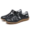 Handgefertigte schwarze Ledersandalen mit Ausschnitten und brauner Gummisohle - 35 / Schwarz