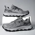 Macro detail of breathable mesh and synthetic leather layers on chunky grey dad sneakers - EU 39 / Gray