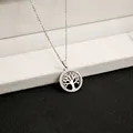 Close-up of tree of life pendant necklace featuring silver plating and white zircons - X139/hollow Tree